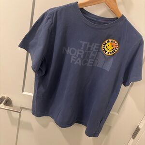 The North Face Short Sleeve Tee in Slate Blue with Yellow Smiley Patch